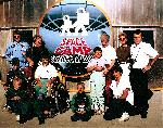 En combinaison de pilote, en haut  gauche, au Space Camp Patrick Baudry  Mandelieu, avec des enfants handicaps (1990)